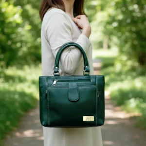 Forest green premium leather handbag with white contrast stitching, structured design, and elegant everyday style